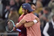Novak Djokovic and Lorenzo Musetti at the 2024 French Open. (Image via Getty)